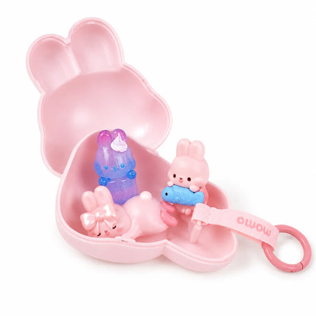 Open pink bunny-shaped diary blind box case with mini figurines and pink keyring