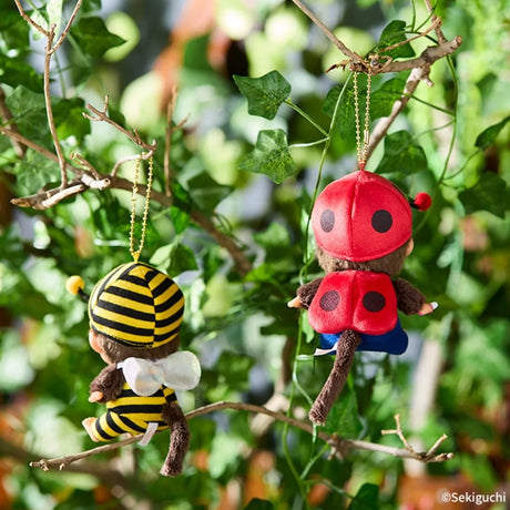 Bee costume bag charm: two Monchhichi plush bee figures in yellow-and-black striped outfits on chains