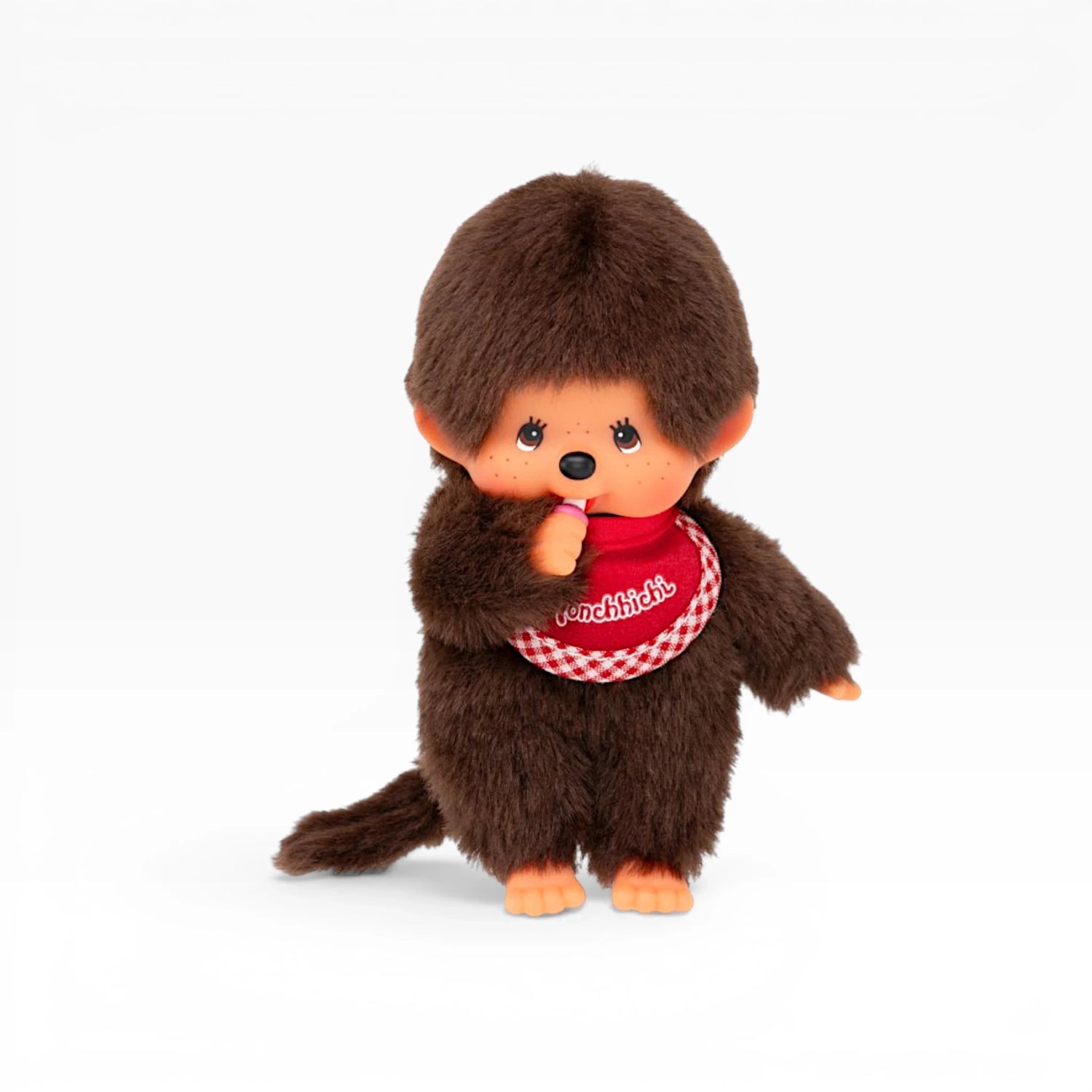 Monchhichi twin boy plush doll, dark brown fur, red plaid bib, side view