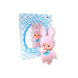 A charming Monchhichi Flocked Figure Blind Box from the Chimutan Series, featuring a pink design with rabbit ears, sits beside its matching packaging.