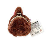 This charming Monchhichi Coin Pouch - Girl by Monchhichi is made of soft plush material, shaped like a brown bear head, and features a metal clasp with an attached tag.