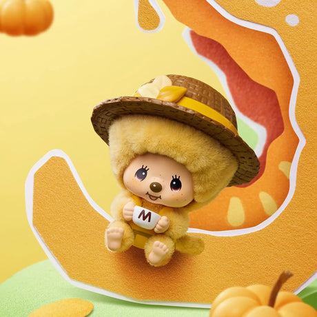Tan hooded Monchhichi pendant figure holding a letter with yellow ribbon hat