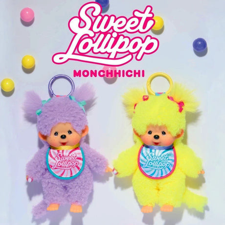 Two Monchhichi Sweet Lollipop bag charms in fluffy purple and yellow outfits with colorful rings and bibs