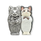 Two cat figurines from the Kitan Club Mummy Cat Blind Box: one features an Egyptian-themed silver cat, and the other resembles a tiny sarcophagus with its mummy-like cat having folded arms.