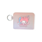 A pink compact mirror with a keyring features "My Melody" with hearts and bunnies, perfectly matching the Sanrio My Melody Card Case for an adorable set.