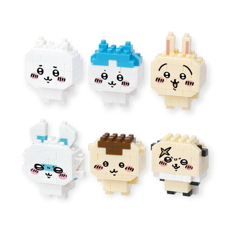 The Nanoblock Chiikawa Figure Blind Bag features six pixel-art style animal faces. These creations by Nanoblock display diverse expressions and colors like white, blue, and beige, reminiscent of the classic block-building style.