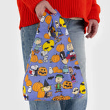 Peanuts Halloween character print baby tote bag in blue fabric held by hand