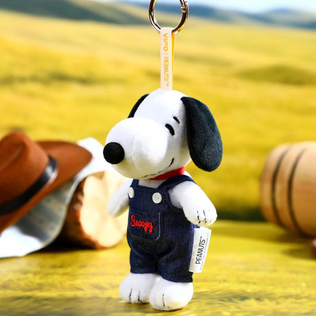 Plush Snoopy denim keychain in navy overalls, side view with metal key ring