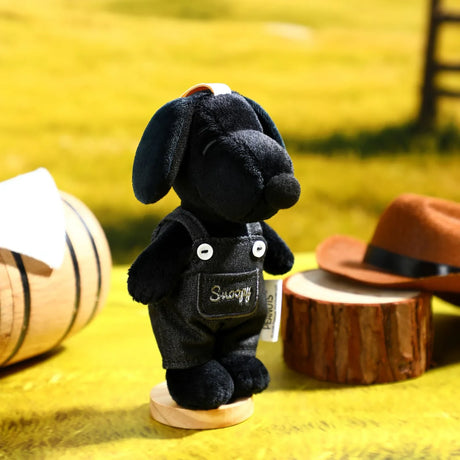 Black Snoopy plush denim keychain with navy overalls, metal key ring and stand