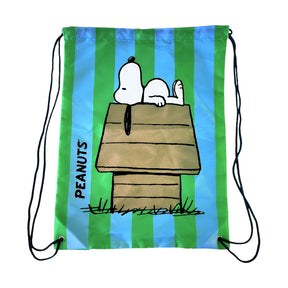 Blue and green striped Peanuts drawstring bag featuring Snoopy sleeping on his doghouse with black cords and PEANUTS text