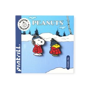 Winter puffer pin set with two enamel pins: Snoopy and Woodstock in red coats