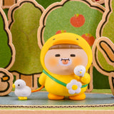Yellow hooded blind-box figurine holding a small white ball, with flower accents.