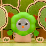 Green-hood blind-box figurine with clear face bubble and orange nose detail.