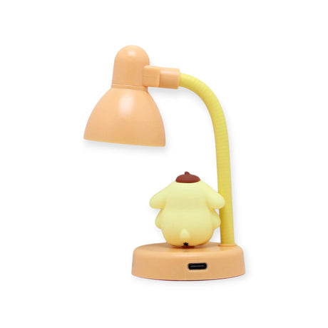 Pompompurin Mini Night Light by Sanrio with yellow character figure facing lamp on peach base and flexible neck