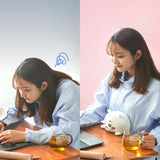 A woman sits at her desk looking stressed with a drink, then appears calm with the Chiikawa Posture Plush Buddy by Chiikawa. The background shifts from blue to pink.