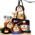 Assorted dog plush keychains in a black tote bag with hanging keyrings