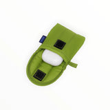 The Green Juice Baggu Puffy Earbuds Case, made from recycled nylon, features quilted padding and reveals a small white object inside.