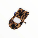 The Baggu Puffy Earbuds Case in leopard print, made by Baggu, features a white earbuds case nestled in a stylish pouch with a visible Velcro closure for protection.