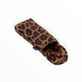 The Baggu Puffy Glasses Sleeve - Leopard, made by Baggu, is crafted from recycled ripstop nylon and provides cushioned protection, revealing a hint of brown sunglasses inside.