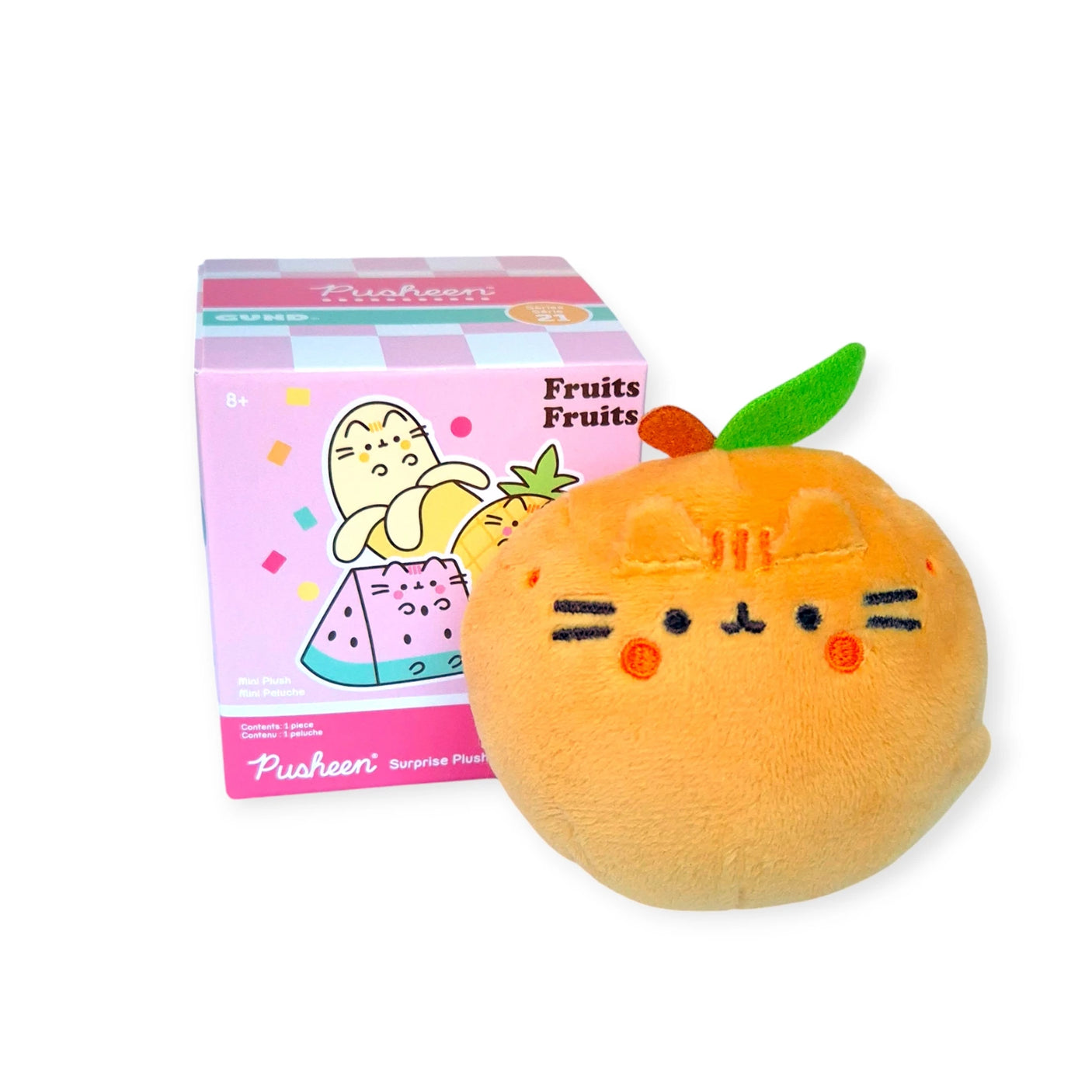 A delightful Pusheen Blind Box - Fruits Series mini plush toy features a charming orange cat with a green leaf, perfectly positioned beside a vibrant "Fruits" box. This adorable plush embodies the whimsical charm of a Pusheen Blind Box surprise by Pusheen.