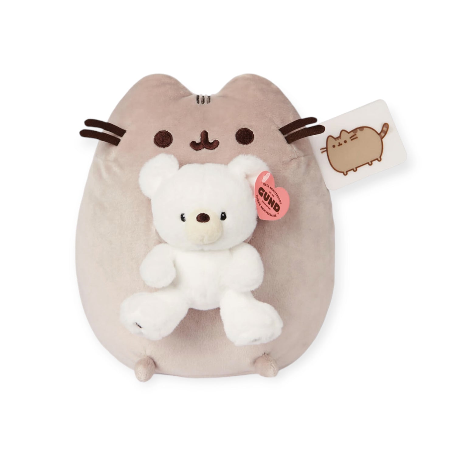 Introducing a lovable companion, the Limited Edition Pusheen x GUND Kai Bear Plush. This 24cm plush toy features Pusheen holding a small white teddy bear, evoking the charm of a classic GUND design and adorned with a tag displaying an endearing illustration of Pusheen.
