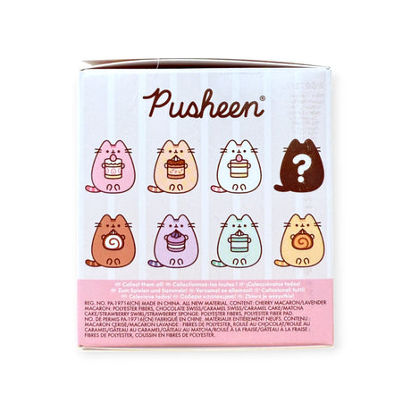 The Pusheen Blind Box - Sweets Series by Pusheen features six adorable dessert-themed cat keychains, a mystery figure, and “Pusheen” text on top—perfect for fans of cute collectible plushies.
