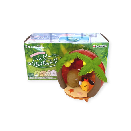 This Re-Ment Sumikko Globe Blind Box toy set includes a miniature tropical hut with palm tree leaves and two charming animal figures, all within packaging reminiscent of a Sumikko Globe illustration.