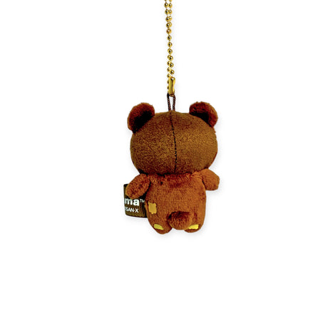 The Rilakkuma - Chairoikoguma Mini Plush Keychain, featuring a side tag and dangling by its chain, epitomizes the charm of cute accessories.