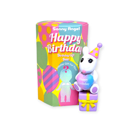 A vibrant toy bear from the Sonny Angel Birthday Bear Gift collection wears a festive party hat and holds a "Happy Birthday" heart while sitting atop gift boxes. Next to it, a cylindrical package displays the cheerful "Sonny Angel" design, making it an ideal whimsical gift for any celebration.