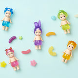 Five Sonny Angel figures from the Candy Store Series, each wearing charming animal hats, are arranged on a light blue background alongside playful candy shapes.