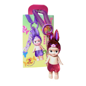 Blind box figure in purple bunny outfit with hanging keyring charm