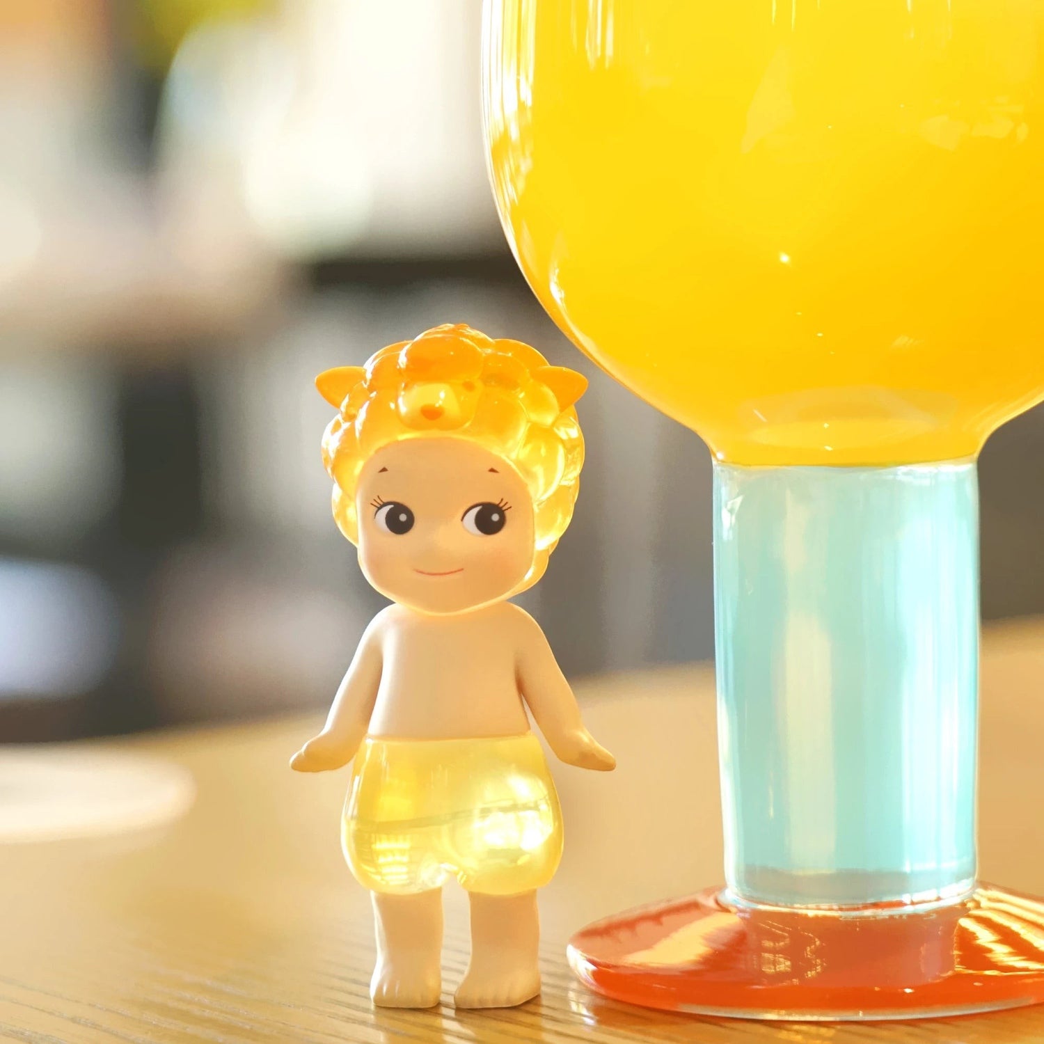 Sonny Angel yellow candy store keychain figurine with clear balloon-shaped base