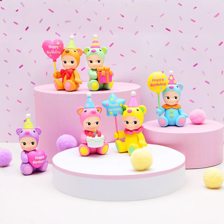 The Sonny Angel Birthday Bear Gifts, by Sonny Angel, feature charming bear-themed figurines adorned with party hats and holding "Happy Birthday" signs, all set on round pink and white bases. Accented with pastel pom-poms, these enchanting collectibles are the ideal festive gift.