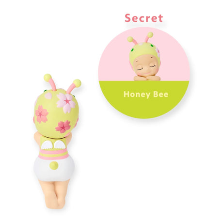 Bee-themed Hippers collectible figure with yellow-green hood, antennae, and flower details