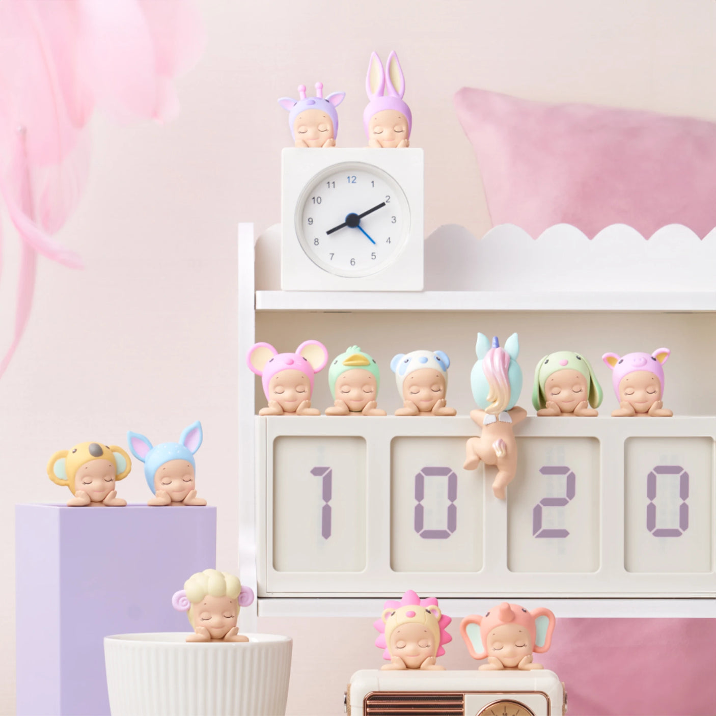 Charming figurines from the Sonny Angel Hippers Blind Box - Dreaming collection by Sonny Angel are dressed as various animals and displayed on a white shelf next to a digital clock reading "10:20," all surrounded by gentle pastel decor.