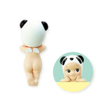 A Sonny Angel Hippers Blind Box - Animals figure features a panda hat when seen from the back, with an inset showing its cheerful face resting on its hands. This charming toy by Sonny Angel can be effortlessly positioned using reusable adhesive for delightful displays anywhere.