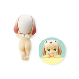 This delightful piece from the Sonny Angel Hippers Blind Box - Animals collection features a whimsical child-like character with dog traits and angel wings. It's designed to peek playfully over a circle on the right while sitting perched on the left, and can be attached anywhere using its reusable adhesive.