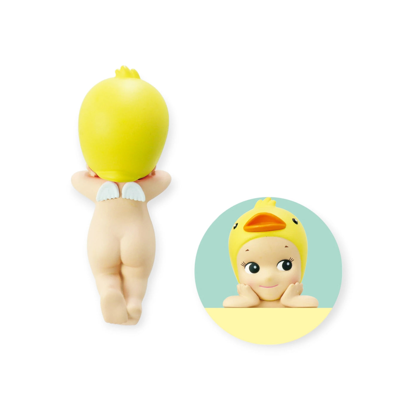 A small figure from the Sonny Angel Hippers Blind Box - Animals series by Sonny Angel is shown lying down from the back, featuring a yellow duck hat and wings. A circular image of the figure's face includes reusable adhesive for effortless placement.