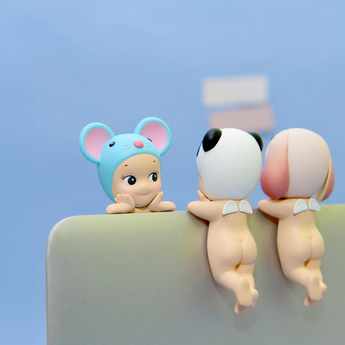 Blue mouse, panda, and bunny-themed Hippers mini figures standing together