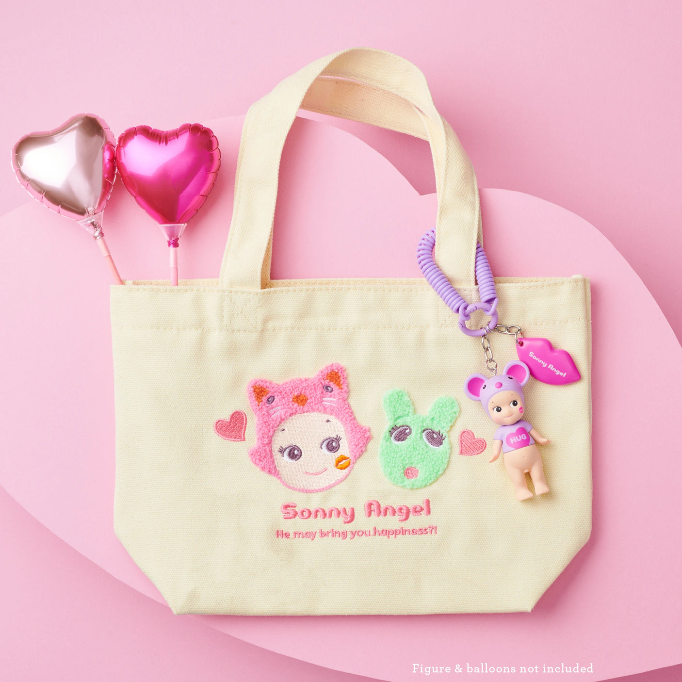 The limited-edition cream Sonny Angel Kiss Kiss Tote Bag features exclusive embroidered designs, accompanied by a keychain with a small doll and two heart-shaped balloons.