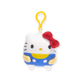 This charming Hello Kitty & Friends keychain showcases the beloved Sanrio character dressed in a blue outfit with a red bow, and includes a convenient yellow clip. It's an ideal accessory for any fan of Hello Kitty merchandise.