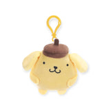 Introducing the adorable Hello Kitty & Friends Keychain featuring a yellow cartoon dog with floppy ears and a brown beret. This charming accessory is perfect for fans of Sanrio characters and seamlessly complements your Hello Kitty keychains collection.