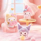 Four fluffy bean plush characters on display, with one standing by small table