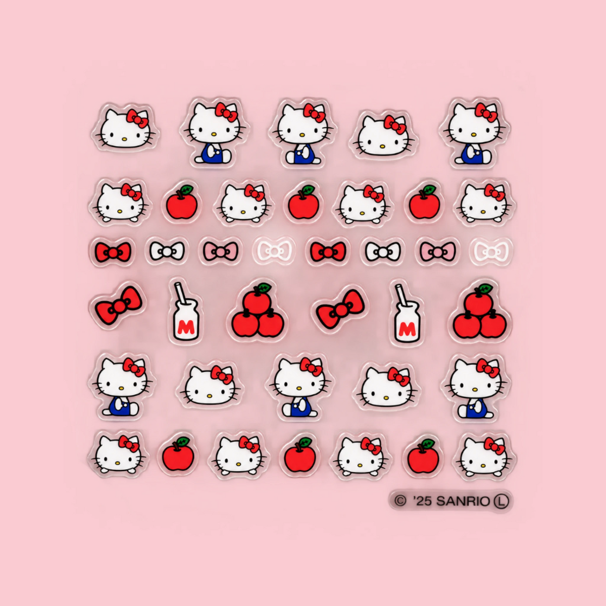 Sheet of Hello Kitty nail decals: face icons, red bows, hearts, and apple shapes