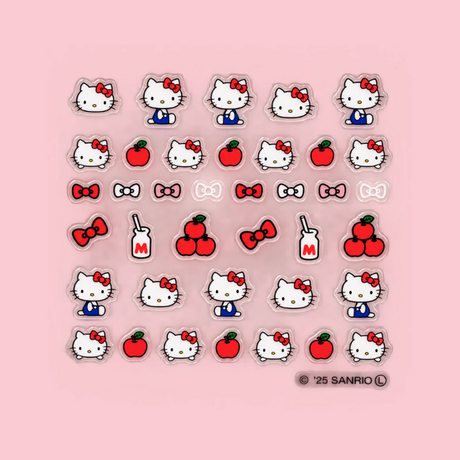 Sheet of Hello Kitty nail decals: face icons, red bows, hearts, and apple shapes