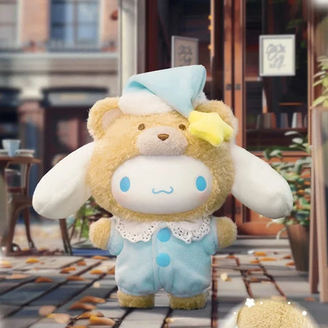 Plush toy wearing a fuzzy bear hood with a blue nightcap and star accessory standing on a leafy outdoor walkway