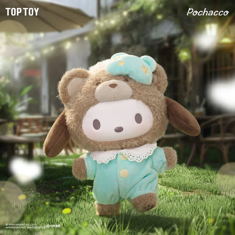 Plush toy dressed in a fuzzy brown bear costume with mint green pajamas and matching nightcap standing on grass outdoors