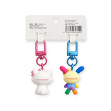Set of two character keychain charms with pink and blue metal clips and plastic figures