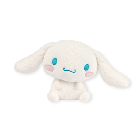 The Cinnamoroll Sanrio Plush - 17cm by Hello Kitty, featuring long ears, blue eyes, and pink cheeks, captures the iconic kawaii charm as it sits against a plain background.