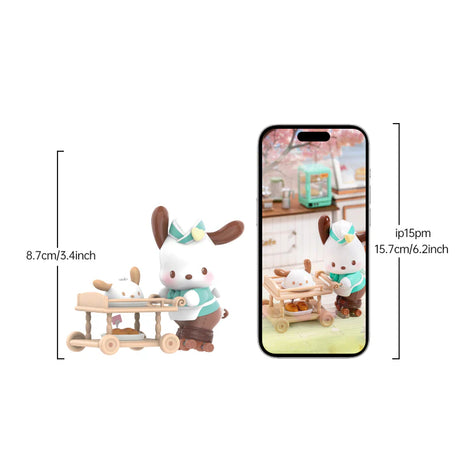 Small white bunny figurine in teal outfit pushing a wooden cart with a smaller bunny inside next to a smartphone display